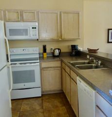 Kitchen, fully equipped with large fridge - freezer & ice maker, full size oven & hobs, microwave, and dishwasher, stocked with crockery, cutlery pots and pans etc, everything you may need for eating in.