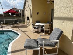 Large south-west facing, fountain pool, with substantial furnished patio area in enclosed screen, surrounded by large grassed gardens.